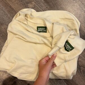 Daily drills brand new. Color is sand. Oversized crew